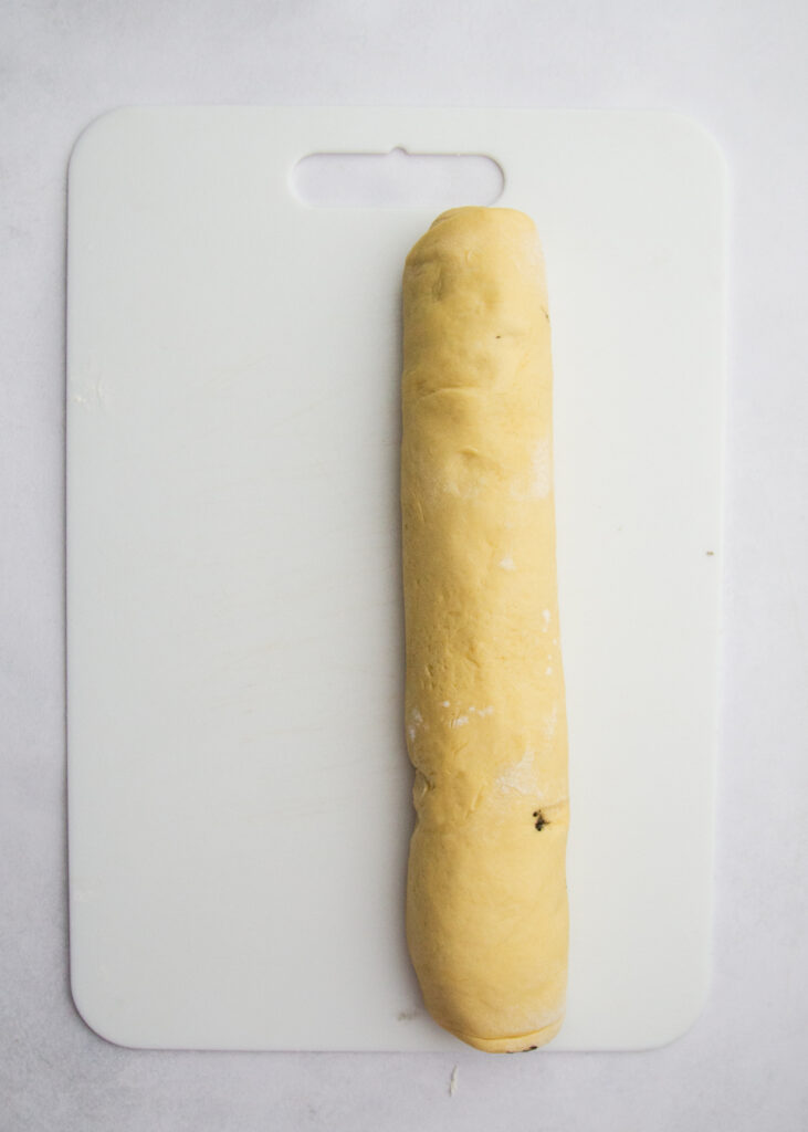 Black sesame dough rolled up into a cyinder.