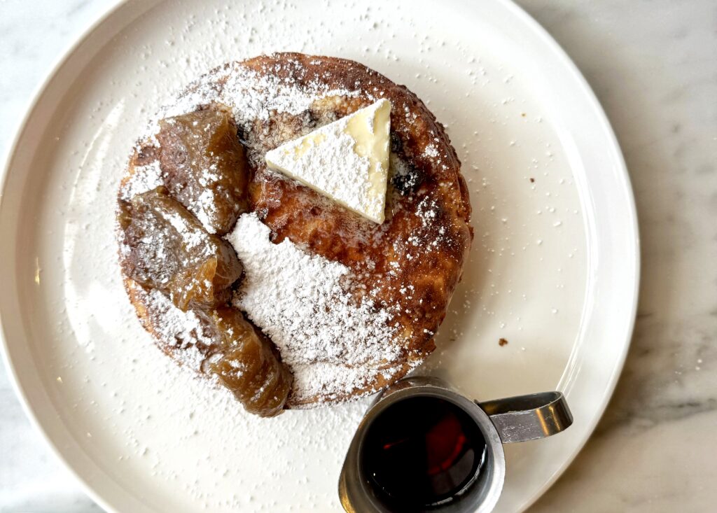 A pancake topped with apple butter and butter from Fossetta.