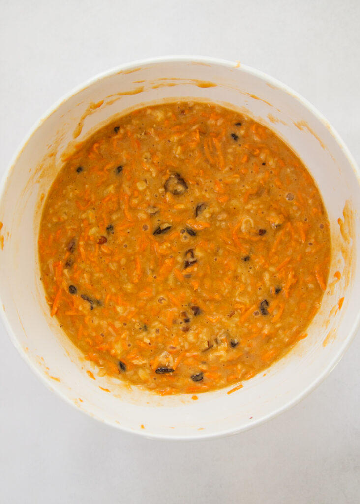 shredded carrot batter in a bowl.