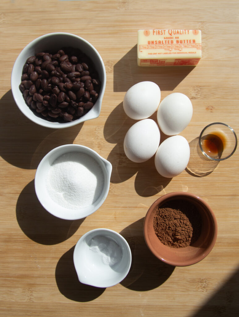 Ingredients for black bean chocolate cake: butter, black beans, eggs, vanilla, sugar, cocoa powder.