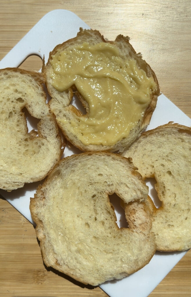 Almond croissant covered in almond paste.