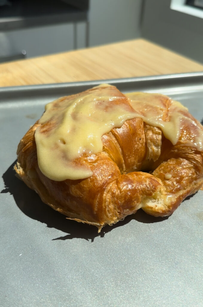 Full croissant with a layer of almond paste on top.