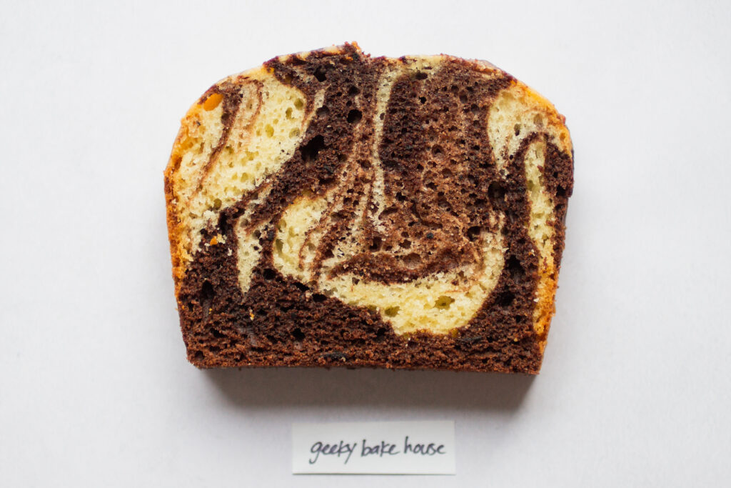a slice of geeky bakehouse marble cake on a white background.