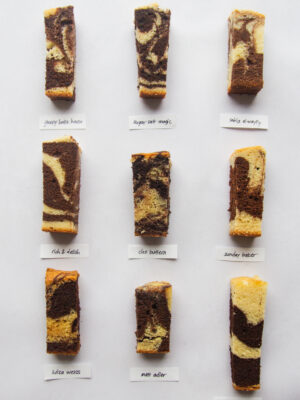9 different slices of marble cake on a gray background.
