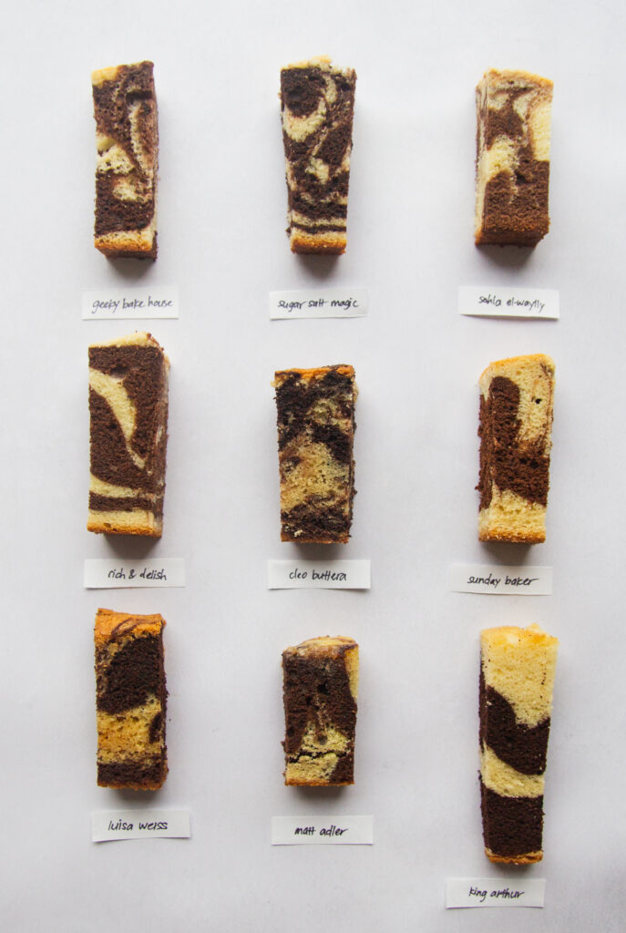 9 different slices of marble cake on a gray background.