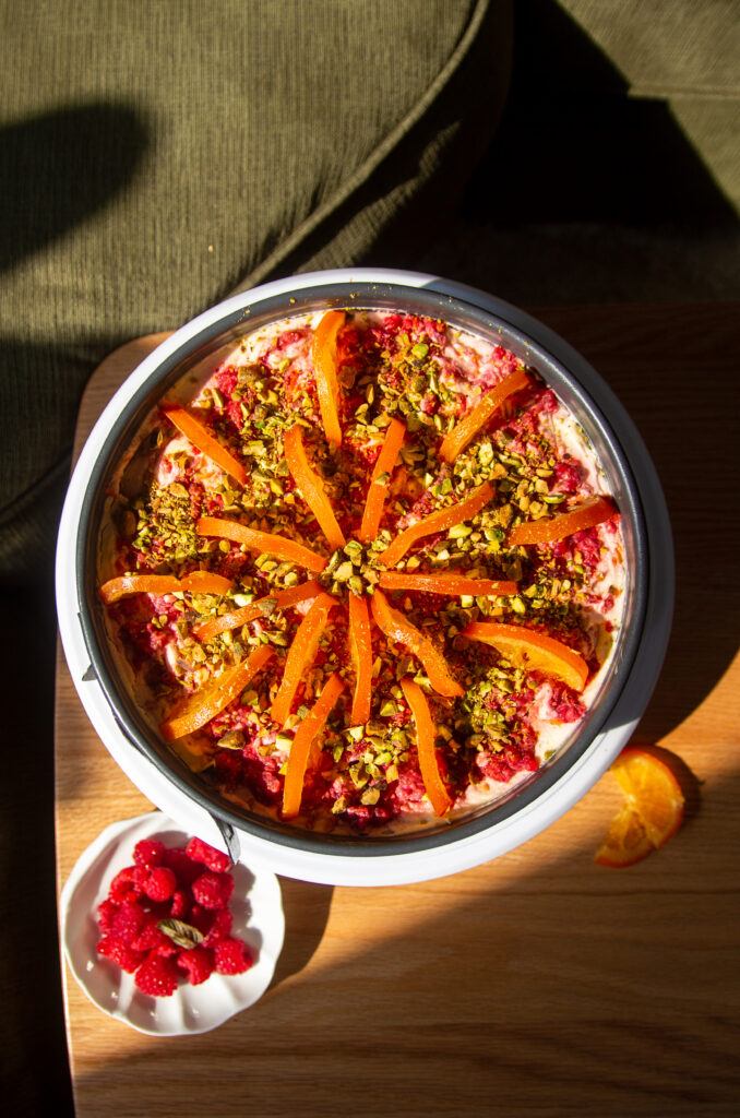 blood orange raspberry tiramisu on a wooden table.