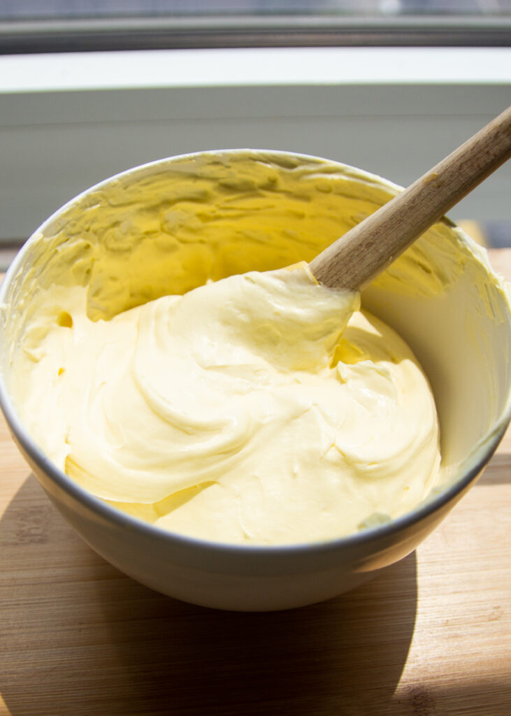 Whipped cream and mascarpone in a bowl.