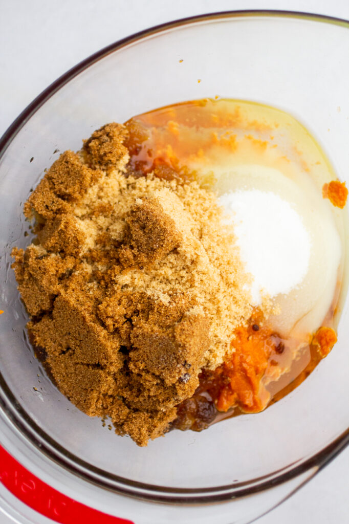 pumpkin, sugars and oil in a mixing bowl.