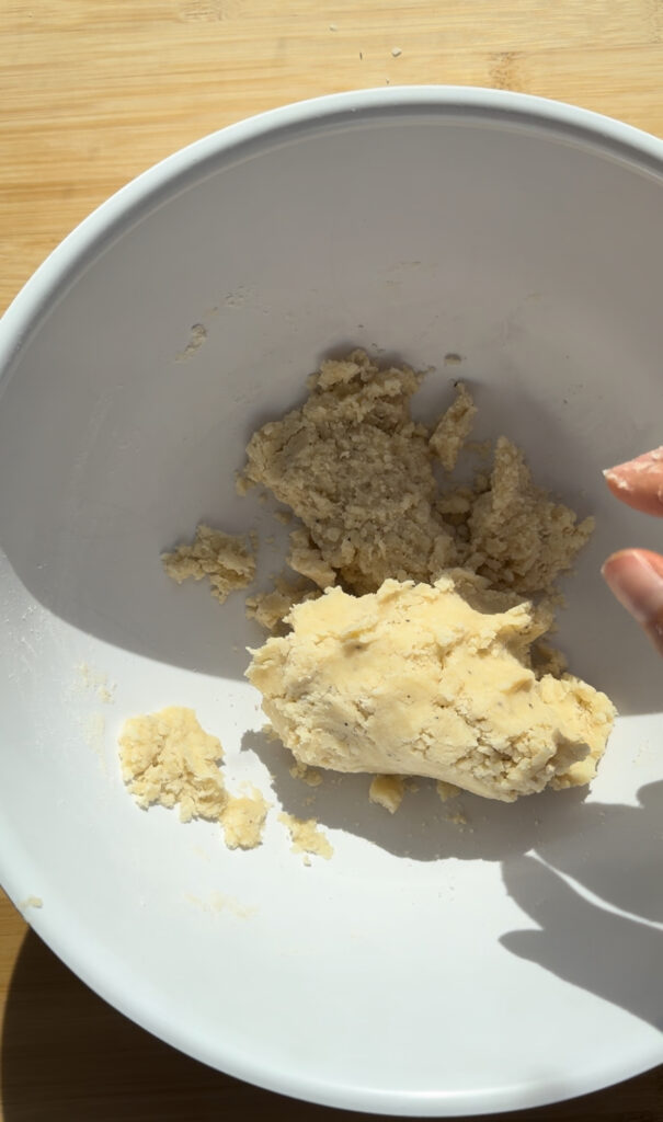 Cheese cookie dough in a white bowl.