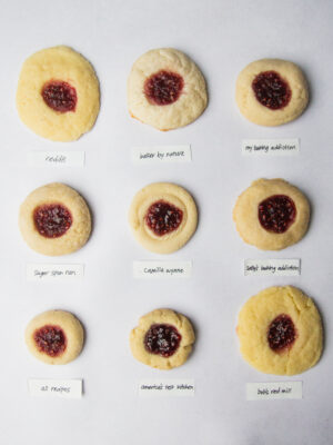 9 thumbprint cookies on a gray background.