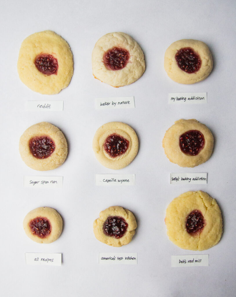 9 thumbprint cookies on a gray background.