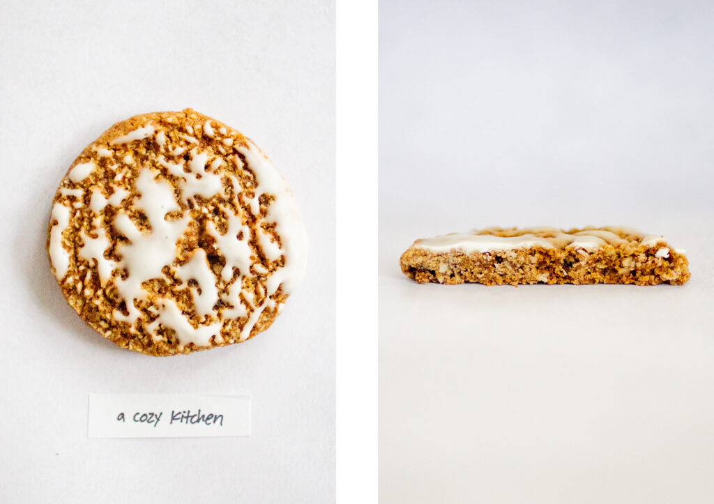 A Cozy Kitchen\'s iced oatmeal cookie on a gray background.