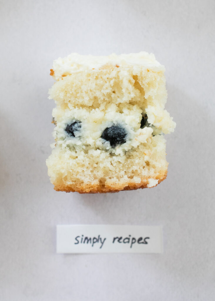 A slice of berry chantilly cake with the label "Simply Recipes."