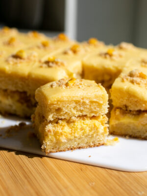 a slice of corn cake on a white cutting board.