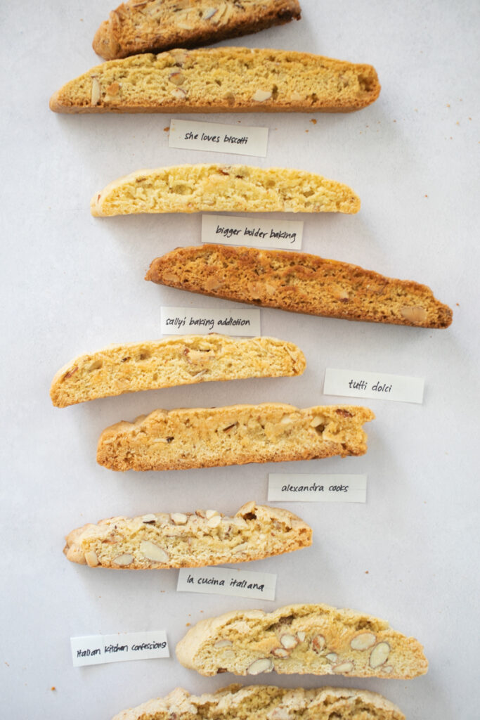 9 different almond biscotti on a gray background.
