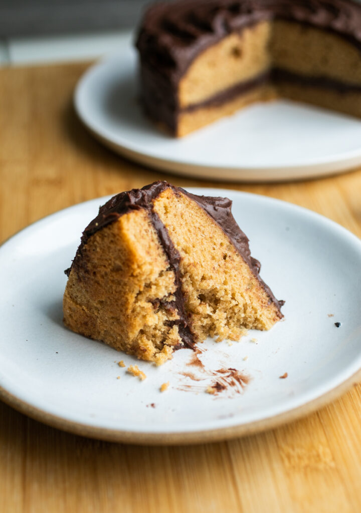 A slice of cake with a bite taken out of it.