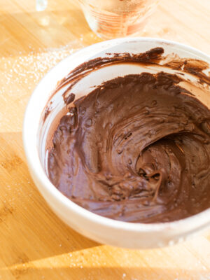 A bowl of chocolate frosting.